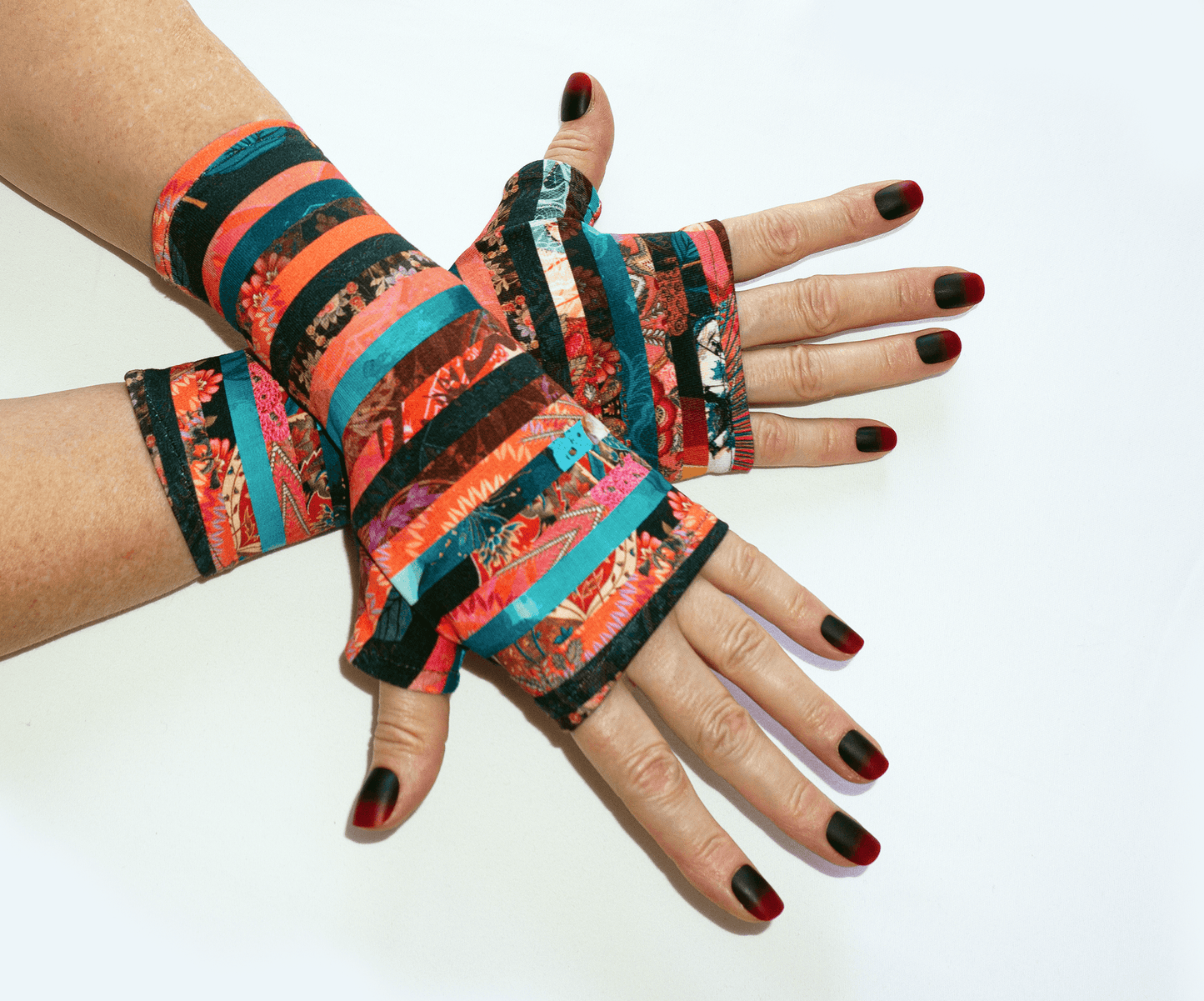 Pulswaermer Handschuhe fingerlos aus French Terry gestreift abstrakt multi